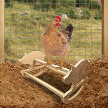 Load image into Gallery viewer, Wooden pig rocker perch with chicken sitting on it inside the coop.