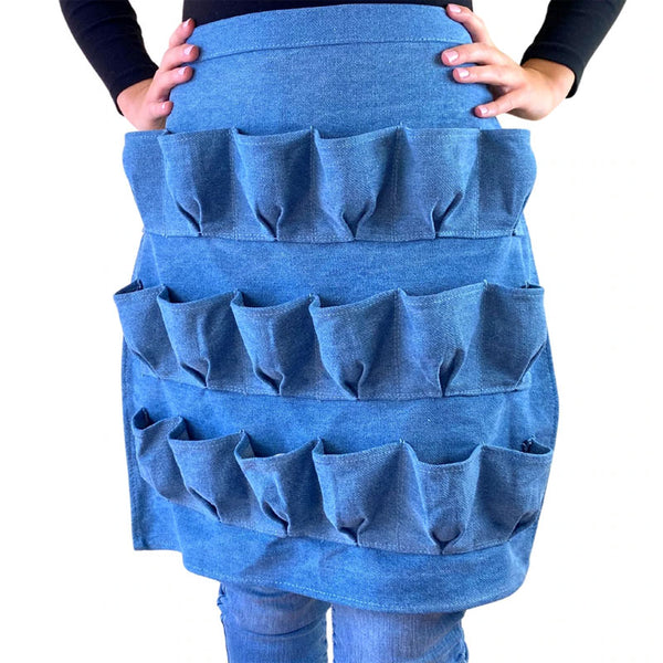 A person wearing a 12-pocket egg collecting apron