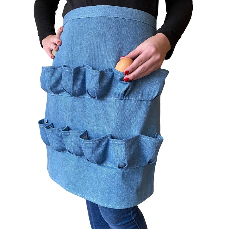 A person wearing a 12-pocket egg collecting apron