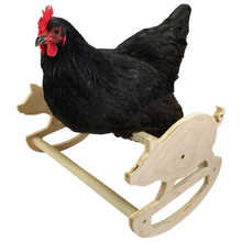 Load image into Gallery viewer, Wooden pig rocker perch with chicken sitting on it.
